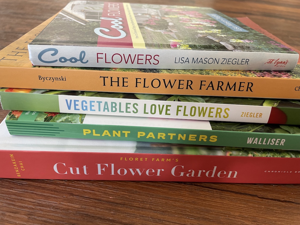 stack of five flower gardening books